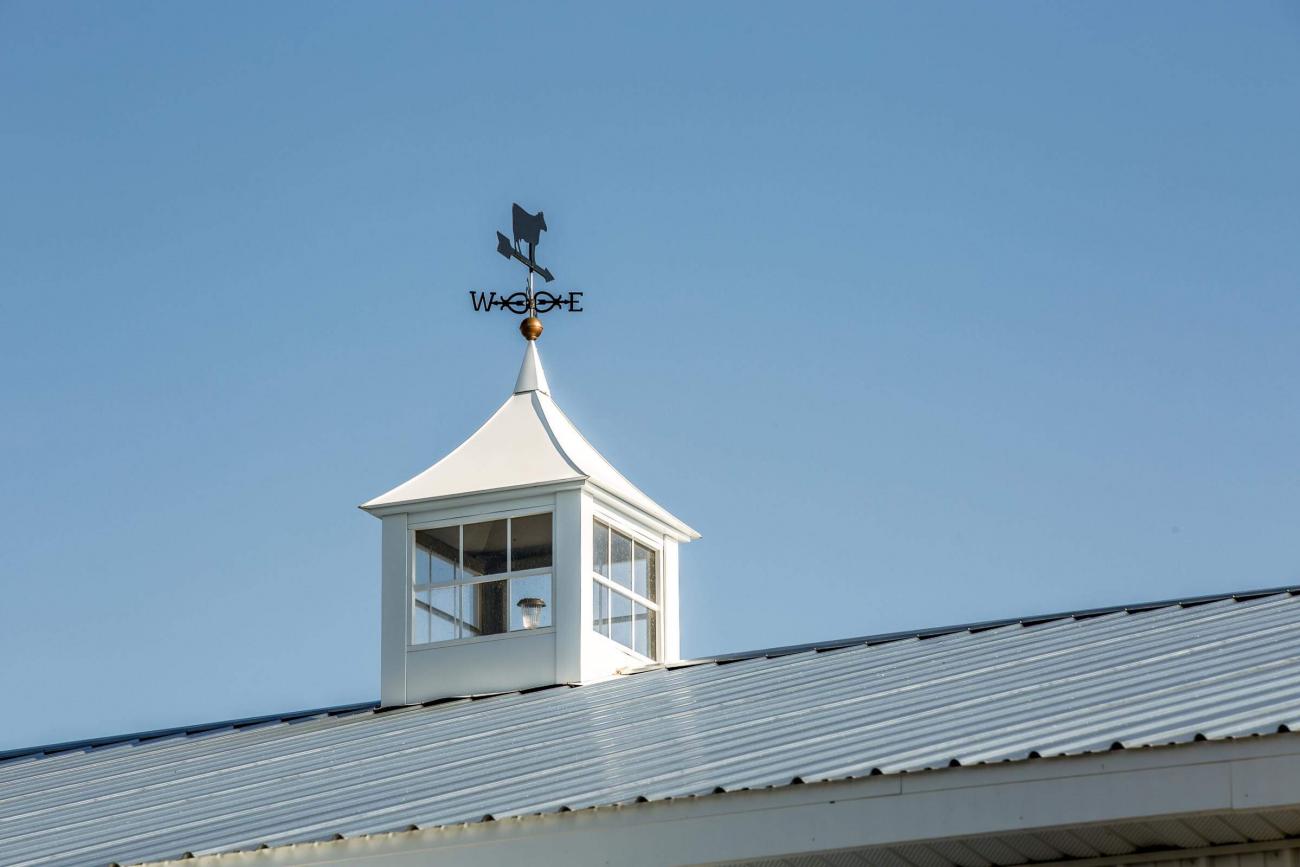 White &amp; Black Metal Barn With Stone Roof