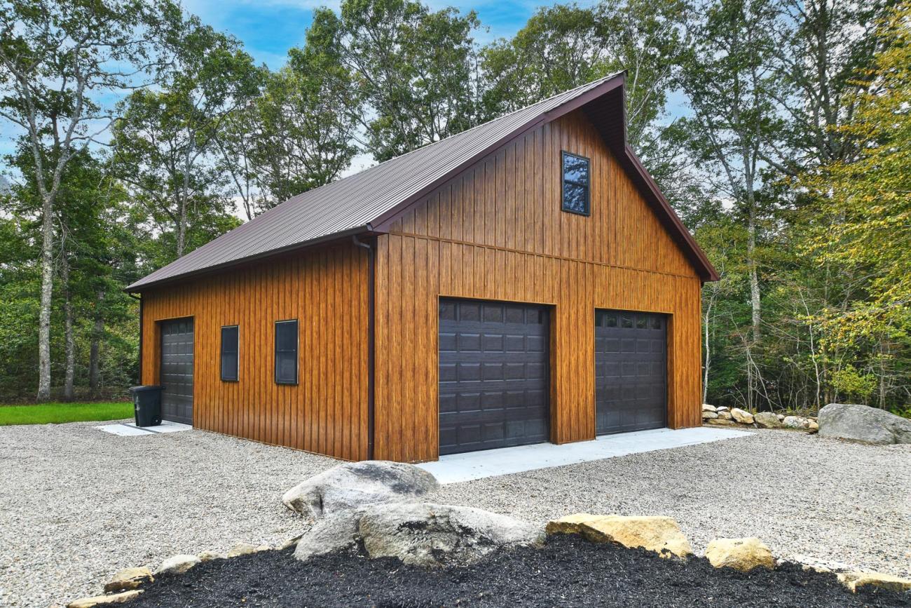 Garage with metal wood-grain board &amp; batten siding
