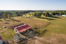 Red Metal Roof Horse Barn Aerial View