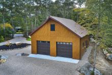 Garage with metal board and batten siding